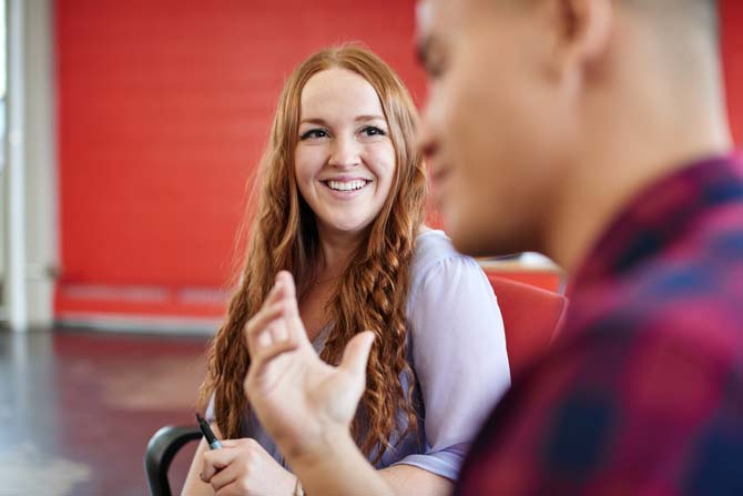 Employees speaking to each other